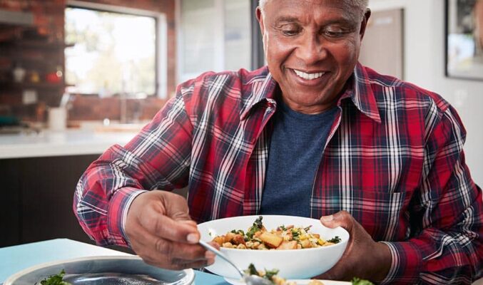 man serving dinner