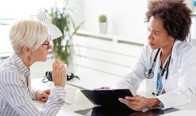 Woman Talking to Doctor