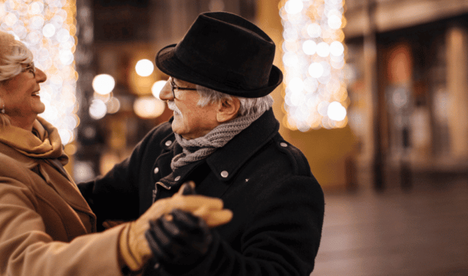 Man & Women Dancing in the Street in Winter