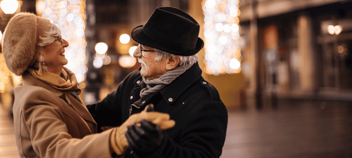 Man & Women Dancing in the Street in Winter