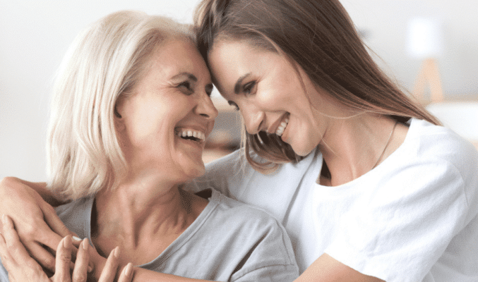 Women and daughter smiling