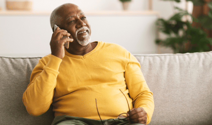 Man on couch on the phone