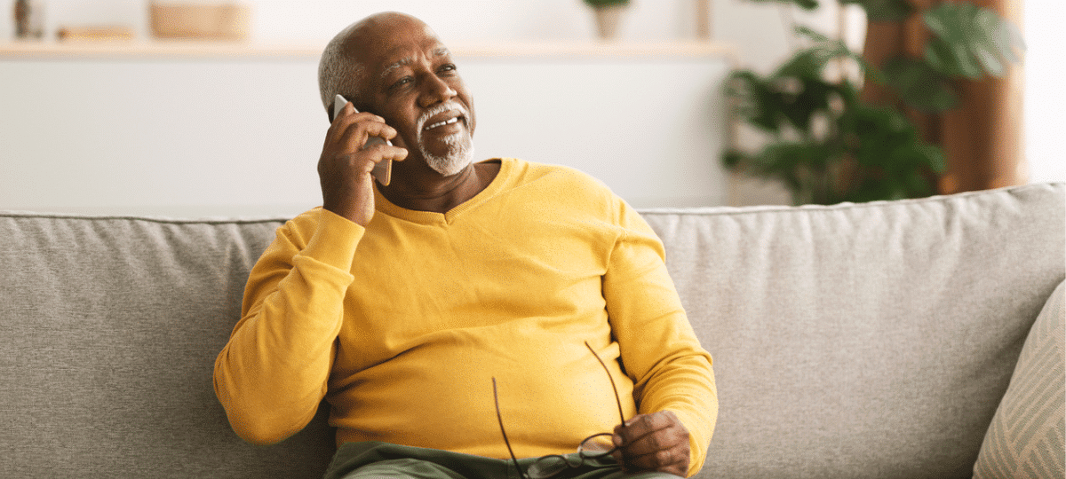 Man on couch on the phone